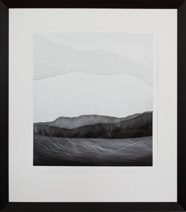 A framed limited edition photographic print featuring abstract representations of a landscape, with cultural references. Frame in a black wedge frame.