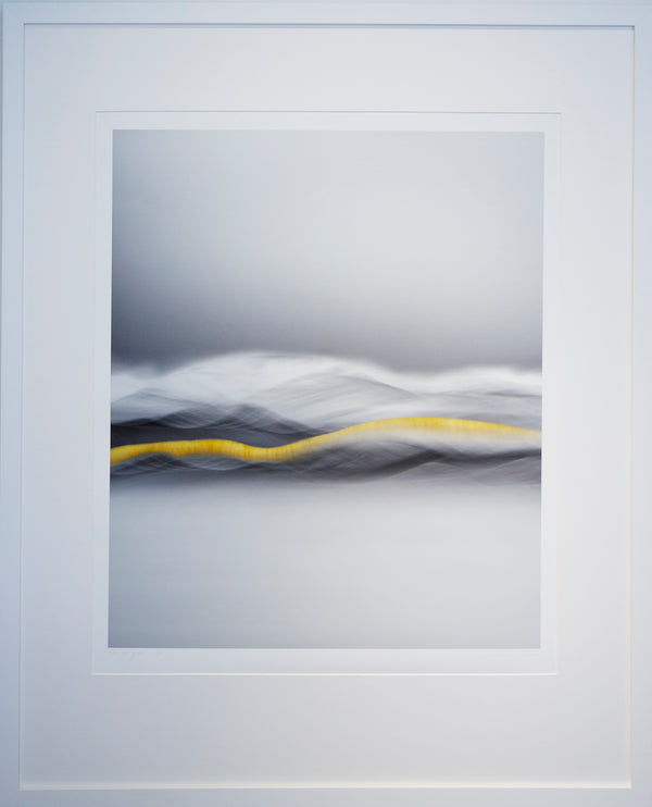 Framed limited edition print titled "vein of gold" print featuring abstract-style wave patterns with a central golden stripe, representing the history of gold in Central Otago set against a grey background.