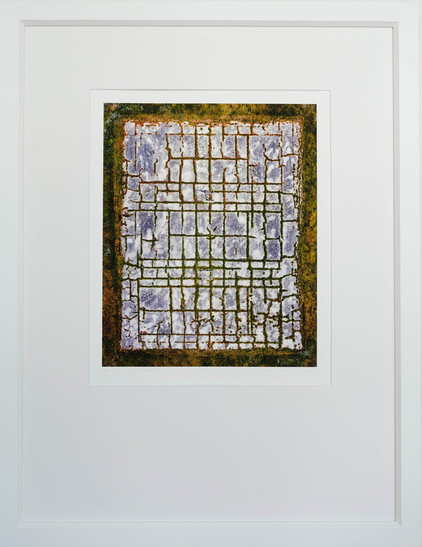 Framed abstract artwork with geometric design on a white background