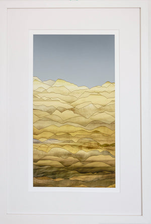 Framed artwork of a stylized landscape with wavy patterns in yellow and brown on a white background.