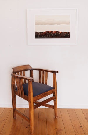 In room image of a landscape print inspired by the Kakanui Mountains , Central Otago and  reflecting the influence of New Zealand printmaker, Marilyn Webb, using simplified lines and muted colours 